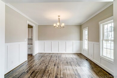 Dinning Room with natural light and chair railing