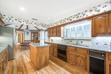 Kitchen featuring sink, light hardwood / wood-styl