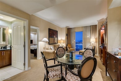 Dining area with baseboards and ornamental molding