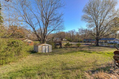 View of yard featuring an outbuilding and a storag