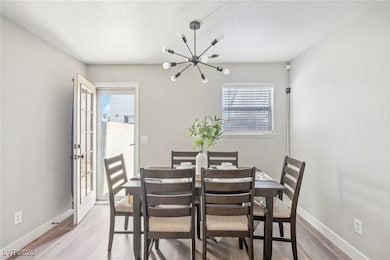 Dining room with upgraded eclectic lighting fixtur