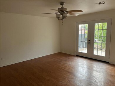 Spare room with french doors, light hardwood / woo