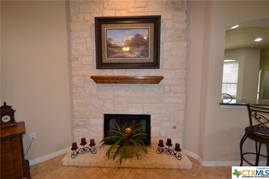 Fireplace has Austin Stone all the way to ceiling.