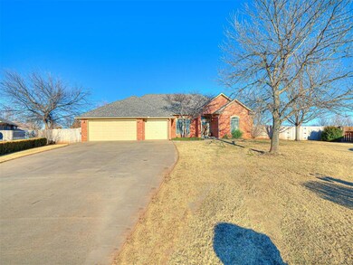Single story home featuring a garage and a front l