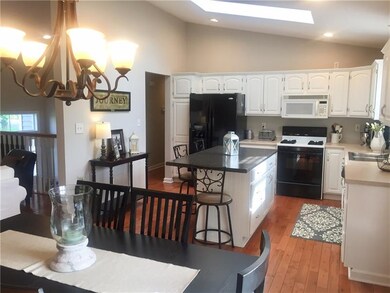 Bright and cheery kitchen .
