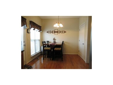 Eating area in kitchen with views of pond!