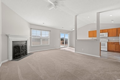 Unfurnished living room with ceiling fan, light co