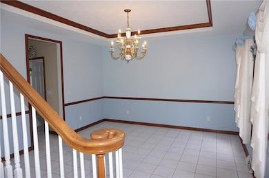 Large bright dining room with custom molding and t
