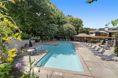 Lovely salt water pool perfect for relaxing. Note mature landscaping.
