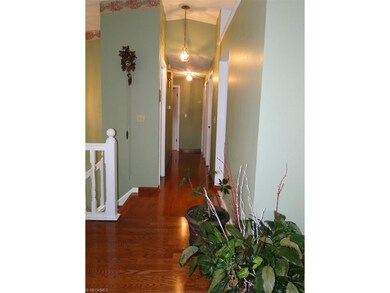 Hallway to bedrooms. the wood floors are warm and 