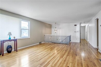 Gorgeous hardwood floors in living room, with wrou