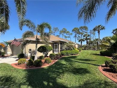 View of side of home with concrete driveway, a law