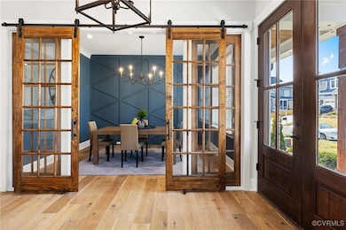 Foyer into dining room with sliding doors.