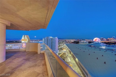 Balcony at twilight with a view of city lights