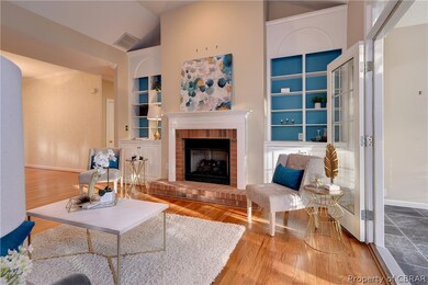 The family room has a gas fireplace and built-ins.