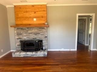 Unfurnished living room with a wood stove, crown m