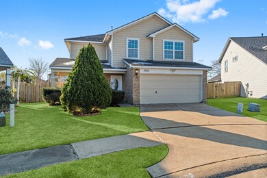 Elegant two-story house with a well-maintained yar
