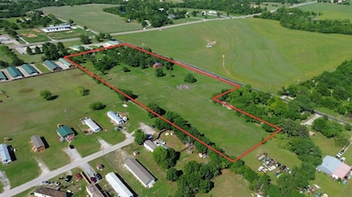 Aerial overview of property's location featuring property approximate boundaries highlighted