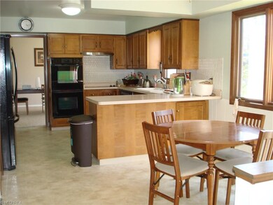 Spacious eat-in kitchen has newer dishwasher and r