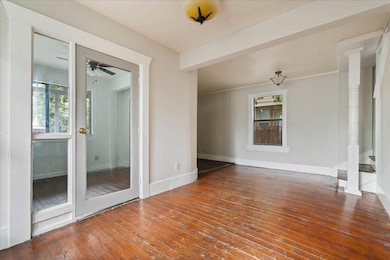 Unfurnished room with hardwood / wood-style floor