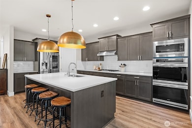 Cooking enthusiasts will love the double ovens and generous counter space in this beautiful kitchen—ideal for preparing everything from weeknight dinners to elegant three-course meals. The walk in pantry will keep all your cooking essential organized and at hand.