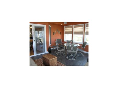 Front Exterior. Sun room with great view if the la