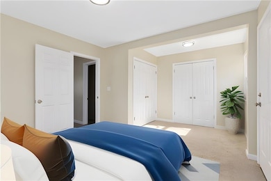 Virtual Staging Carpeted bedroom featuring a closet and baseboards