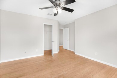 Unfurnished bedroom with light hardwood / wood-sty