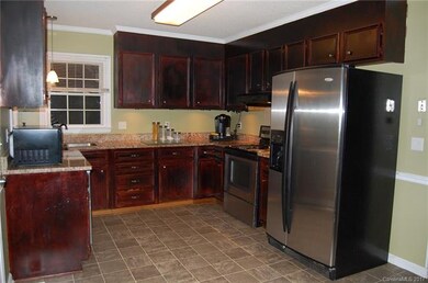 KITCHEN WITH GRANITE COUNTERTOPS AND LOTS OF CABIN