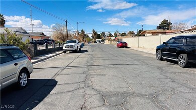 View of street with curbs, sidewalks, and a reside