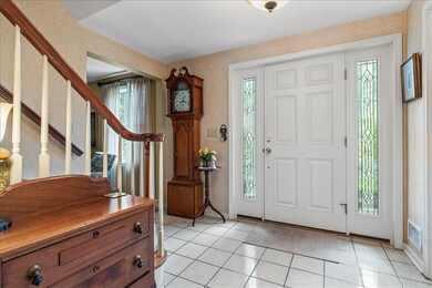 Step into the welcoming foyer and hang you coat in