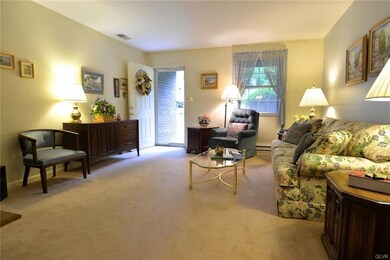 ENTER LIVING ROOM FROM COVERED FRONT PORCH