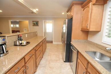 Updated kitchen with granite counter tops, maple c