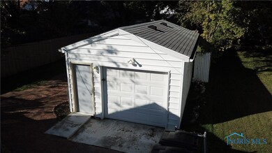Newer Car and half garage with extra storage.