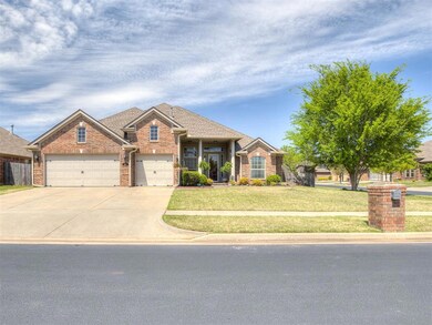 View of front of home with concrete driveway, fenc