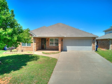 Ranch-style house featuring concrete driveway, a f