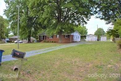 Front Exterior & Driveway & Garage & Storage Build