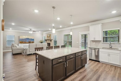 Kitchen with pendant lighting, white cabinet.