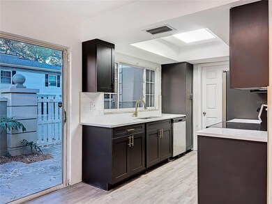 Modernized Kitchen,  Black Cabinets, Quartz Counters, Soft close cabinets / drawers