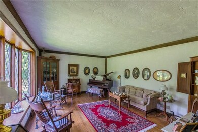 Beautiful Front Living Room with Hardwood Flooring