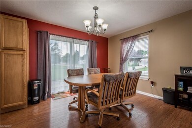 Large dining area with patio door to the backyard