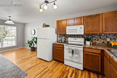 The oakwood floors continue into the kitchen