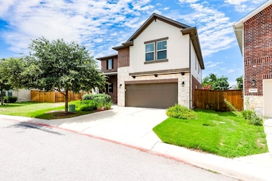 View of front of property featuring an attached g