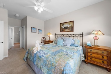 Bedroom featuring visible vents, a ceiling fan, li