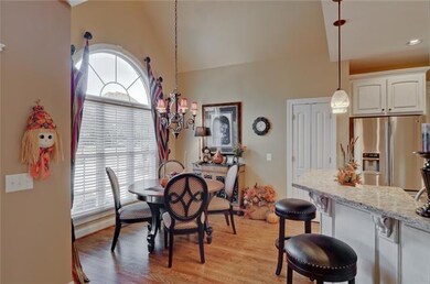 Spacious breakfast room with gorgeous view of back yard. Lots of natural light.