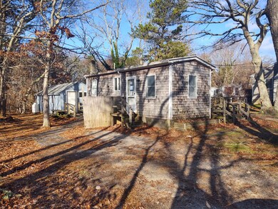 Left side of home with entry into back addition.