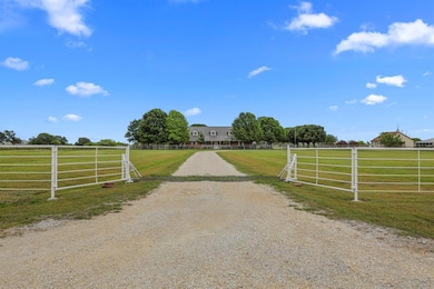 Amazing wide view of property with cattleguard and pipe fence