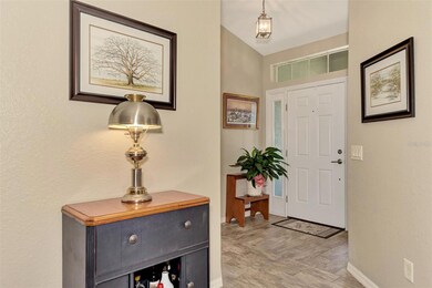 Transom window above front door and side windows allow natural light to flow into the home.