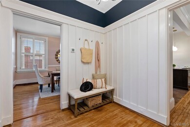 Unit 6 has a bright foyer with wainscoting.