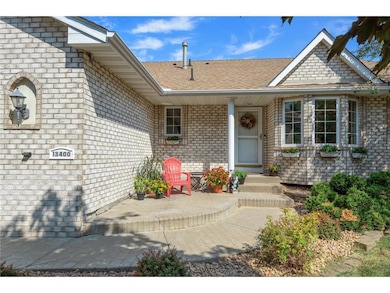 Welcoming front entry with stamped concrete patio